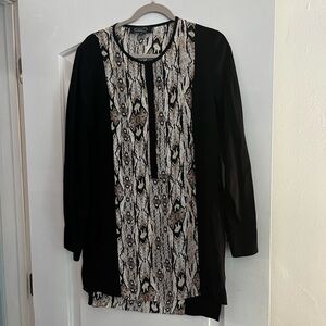 Magaschoni silky black top with animal print insert.